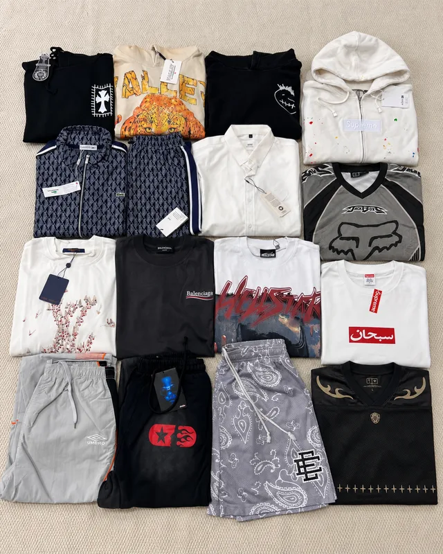 Flat-lay overview of the winter-themed haul with hoodies, shirts, jerseys, shorts and trousers.
