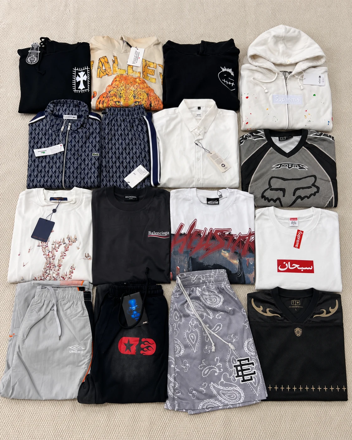 Flat-lay overview of the winter-themed haul with hoodies, shirts, jerseys, shorts and trousers.