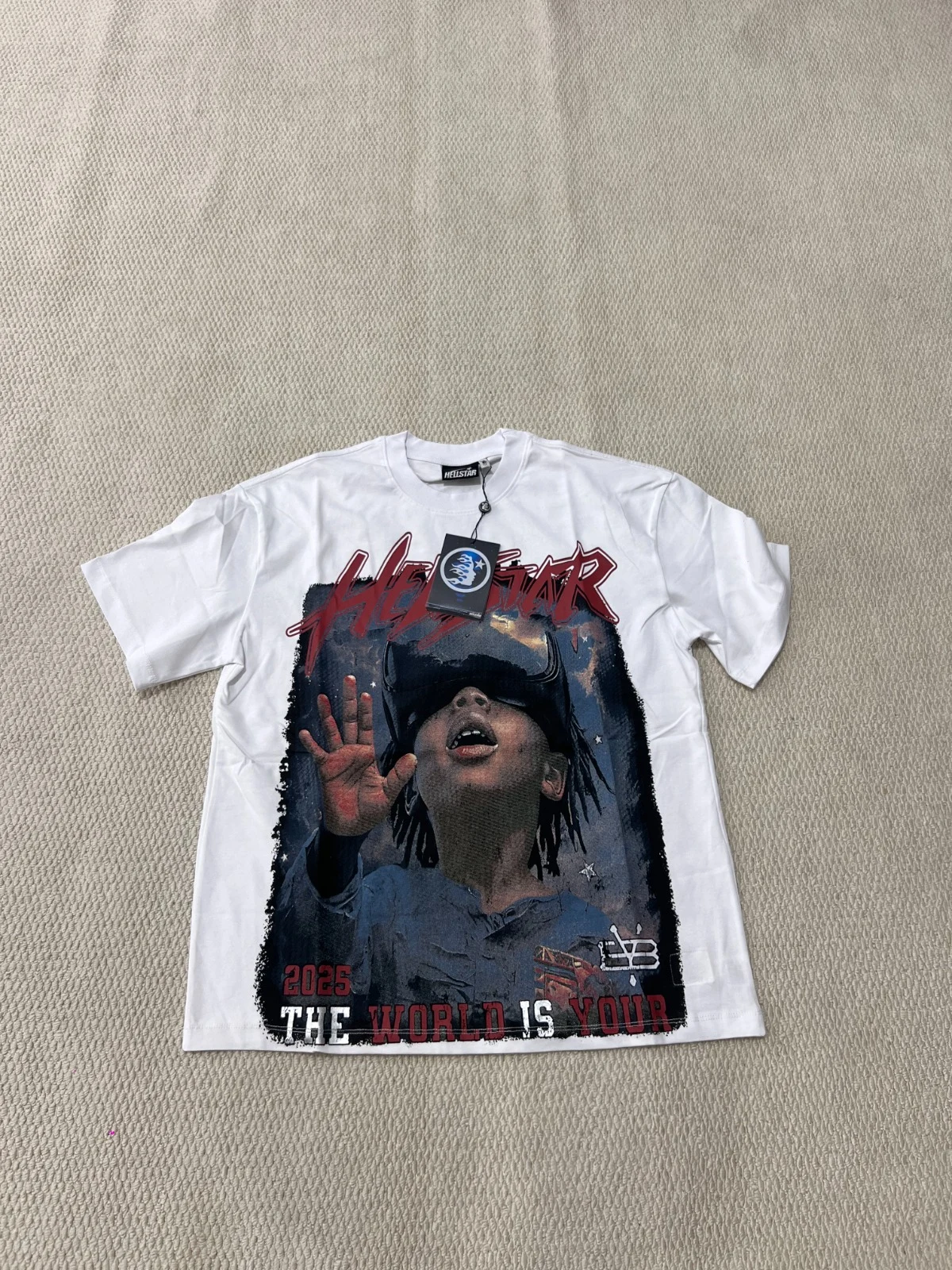 White T-shirt with a multicolored portrait graphic covering much of the front.